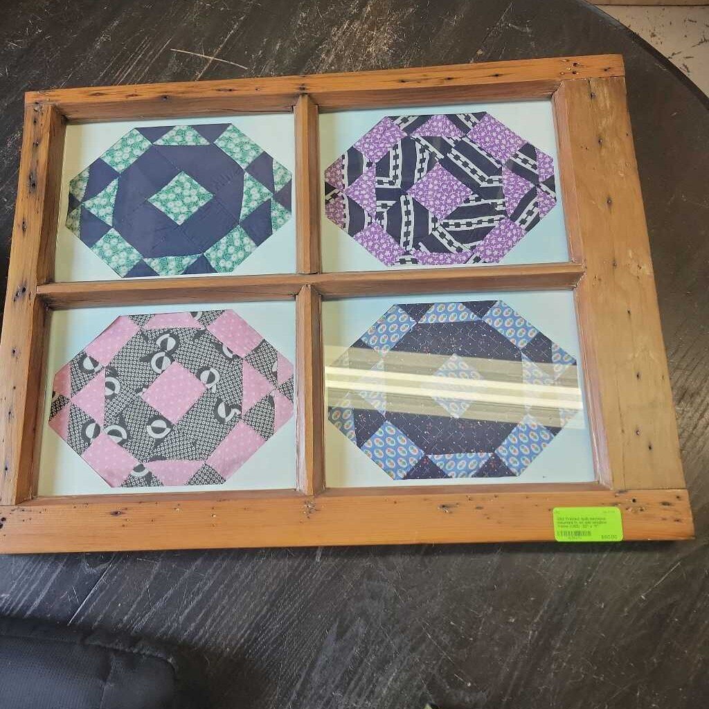 Framed quilt sections mounted in an old window frame (US2)