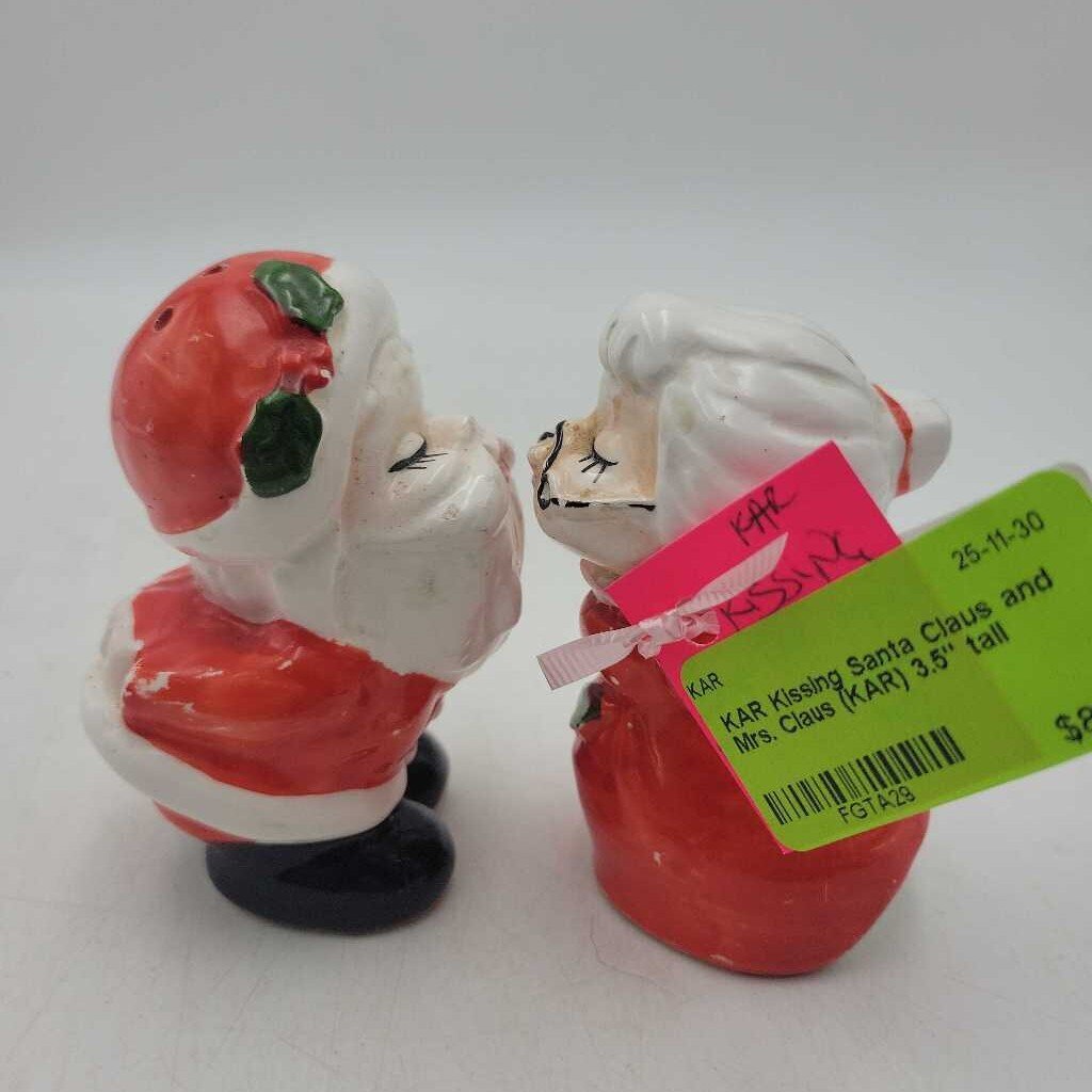 Kissing Santa Claus and Mrs. Claus (KAR)