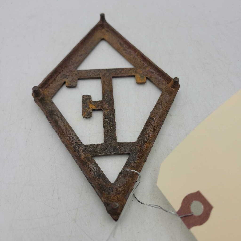 Cast Iron Trivet T Eaton (JAS)