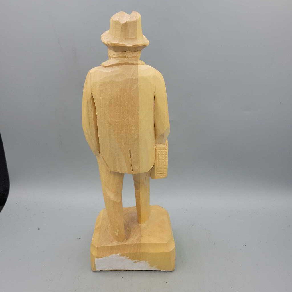 Hand Carved Wooden Man holding bag (JAS)