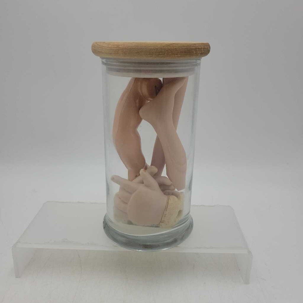 Sealed jar with doll appendages (US2)
