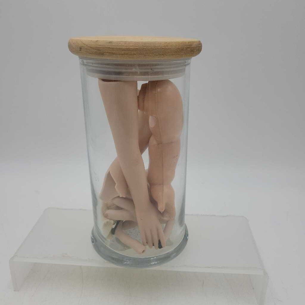 Sealed jar with doll appendages (US2)